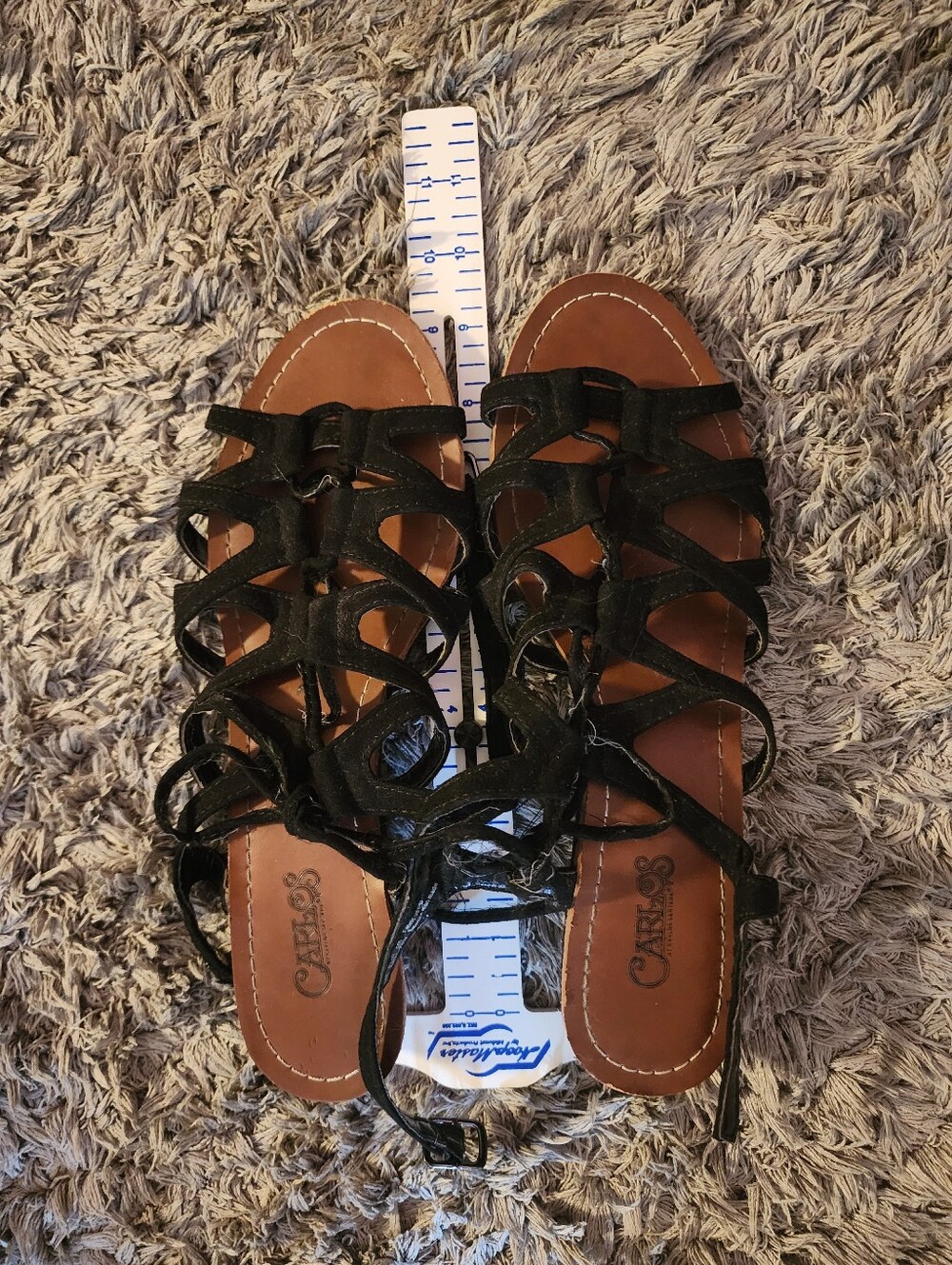 Black leather sandals with criss-cross straps
